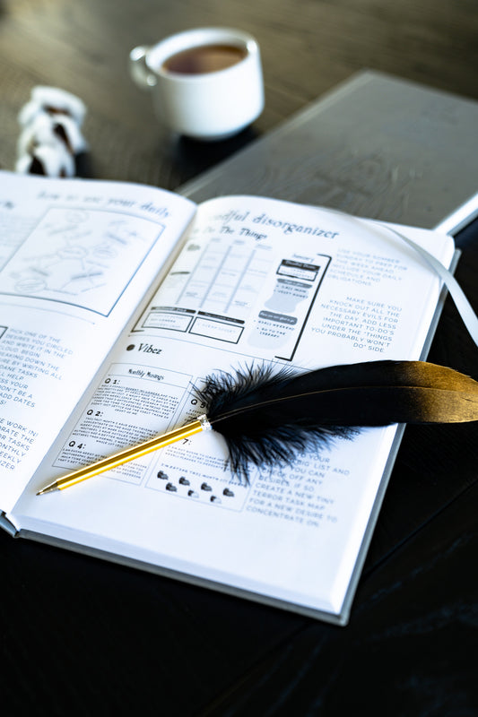 Gold Tipped Feather Pen