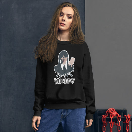 Black sweatshirt with Wednesday Addams and Thing hanging out on her shoulder